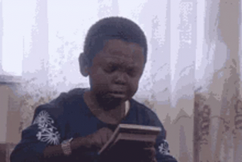 Young Boy Crying Holding Cell Phone
