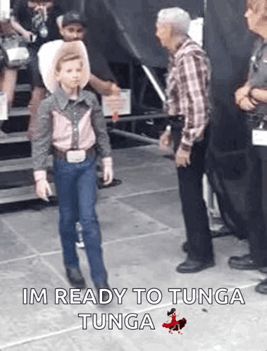 Young Boy Dressed as Cowboy Walking