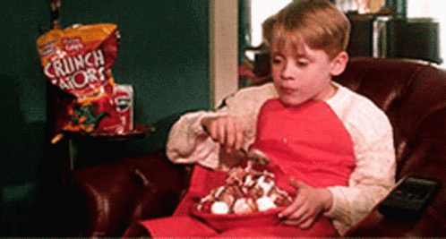 Young Boy Eating Bowl of Crunch Shorts