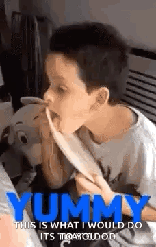 Young Boy Eating With Tongue Out