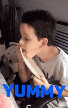 Young Boy Eating Yummy Food