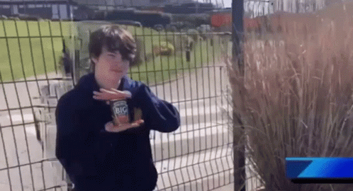 Young Boy Holding Can of Big Mac