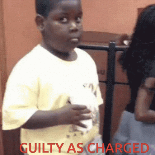 Young Boy Holding Guilty as Charged Cup