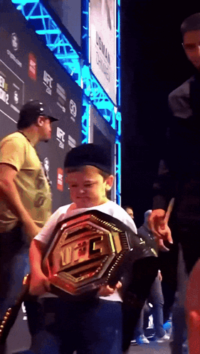 Young Boy Holding UFC Belt GIF