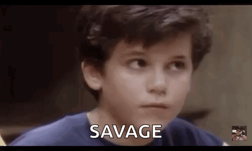 Young Boy In Blue Shirt Making Funny Face Saying Savage GIF