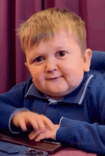 Young Boy In Blue Sweater At Keyboard GIF