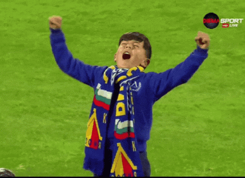 Young Boy in Blue Sweatshirt With Du Scarf