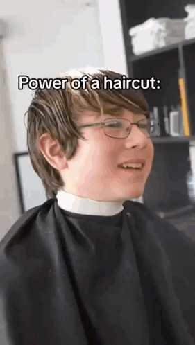 Young Boy In Glasses And Cape Getting Haircut GIF