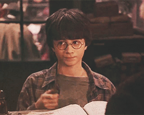 Young Boy In Glasses With Book GIF