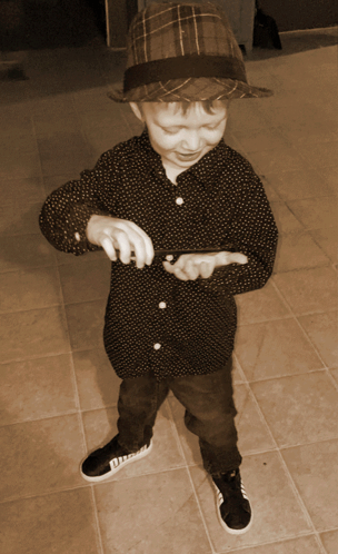 Young Boy In Hat And Polka Dot Shirt GIF