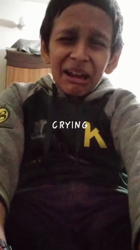 Young Boy in Hurley Sweatshirt Crying