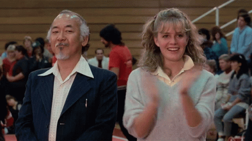 Young Boy In Karate Uniform Facing Crowd GIF