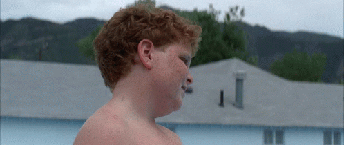 Young Boy in Life Jacket at Pool Edge