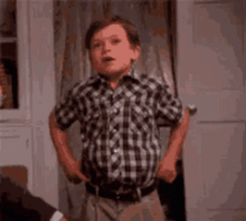 Young Boy in Plaid Shirt Saying Fashion