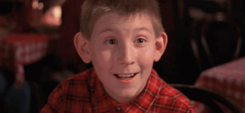 Young Boy in Plaid Shirt Smiling