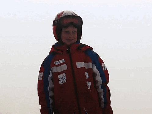 Young Boy In Red Jacket With Allianz Sticker GIF