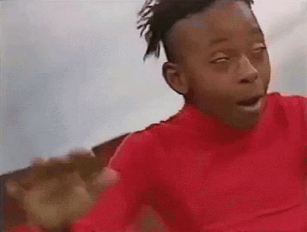 Young Boy In Red Shirt Making Funny Face GIF