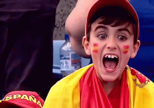 Young Boy in Spain Hat and Yellow Red Scarf