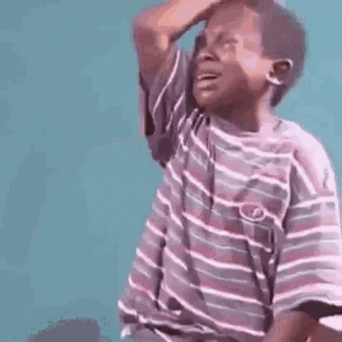 Young Boy In Striped Shirt Scratching Head GIF