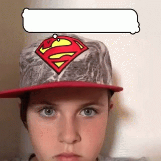 Young Boy in Superman Hat with Speech Bubble