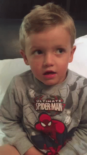 Young Boy in Ultimate Spider-Man Sweatshirt