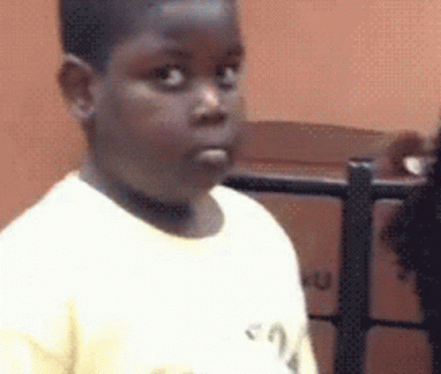 Young Boy In White Shirt Making Funny Face GIF