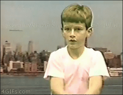 Young Boy In White Shirt With City Skyline GIF