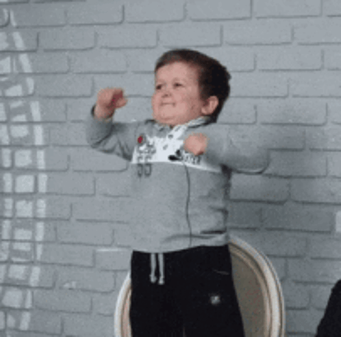 Young Boy In World Blitzer Sweater GIF