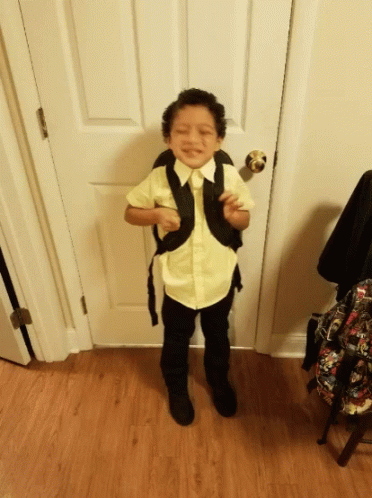Young Boy In Yellow Shirt And Black Pants GIF