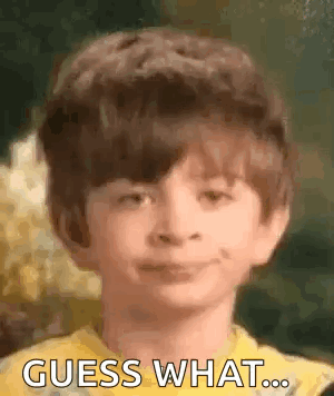 Young Boy in Yellow Shirt Smiling Guess What