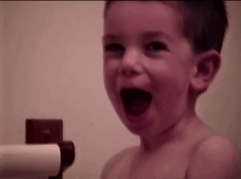 Young Boy Laughing In Bath GIF