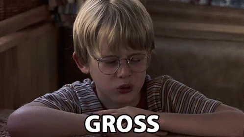 Young Boy Laying Down With Gross Above
