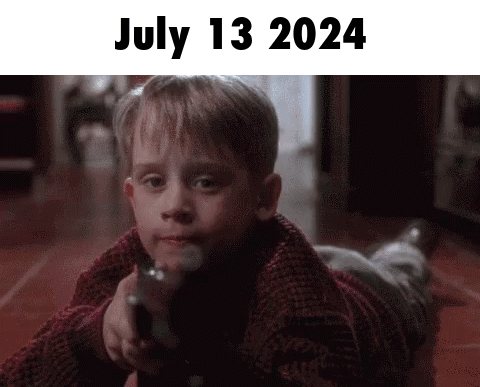 Young Boy Laying on Floor Pointing Gun July 13 2024
