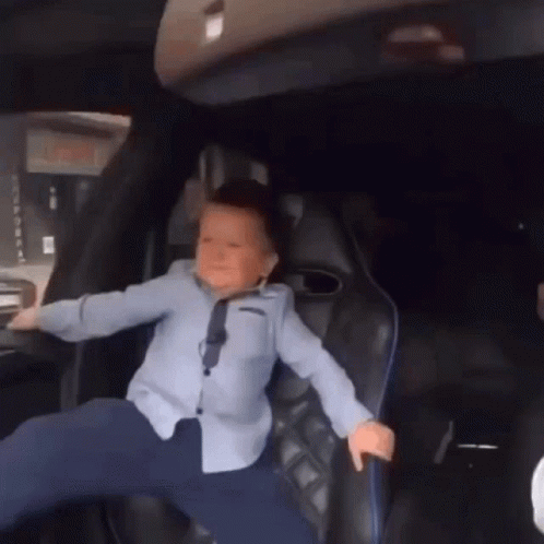 Young Boy Legs Crossed in Back Seat