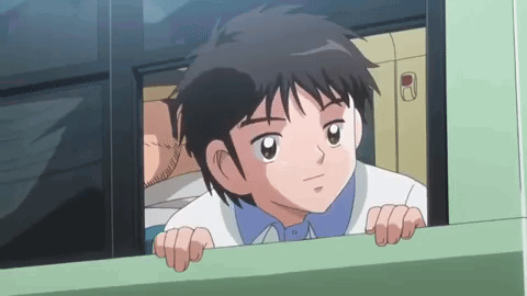 Young Boy Looking Out Bus Window