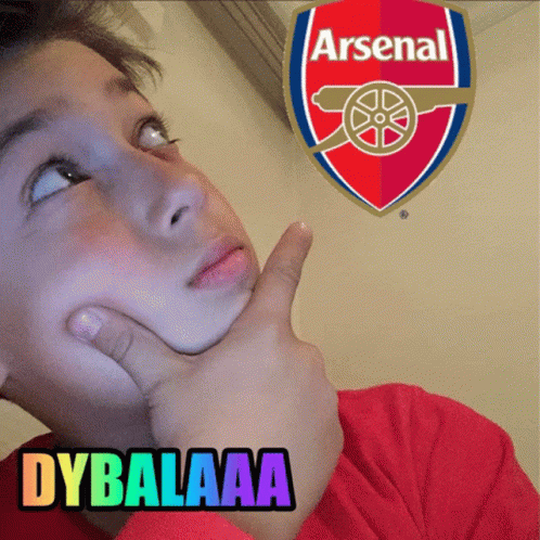 Young Boy Looking Up at Arsenal Emblem