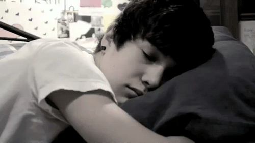 Young Boy Lying In Bed Eyes Closed GIF