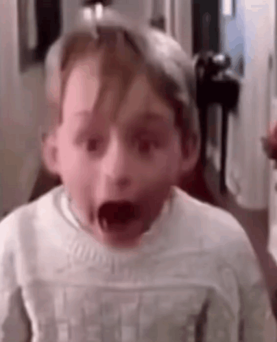 Young Boy Making Funny Face GIF