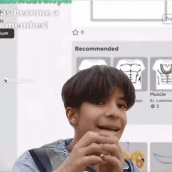 Young Boy Making Funny Face Holding Hands in Front of Computer Screen
