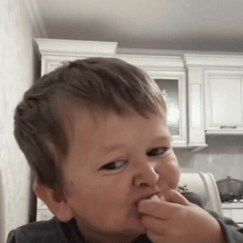Young Boy Making Funny Face With Finger In Mouth GIF