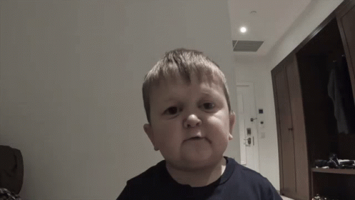 Young Boy Making Funny Face With Open Mouth