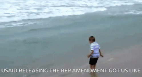 Young Boy on Beach Usaid Releasing RFP Amendment Got Us Like