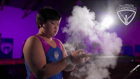 Young Boy Putting Chalk On His Hand GIF