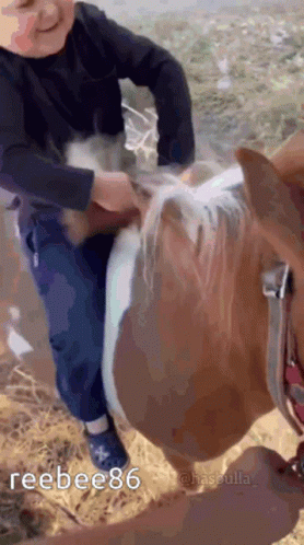Young Boy Riding Brown and White Horse