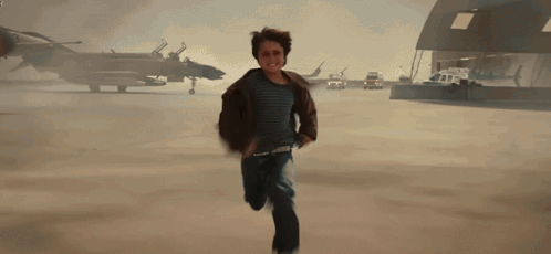 Young Boy Running On Airport Runway GIF