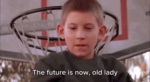 Young Boy Sitting in Front of Basketball Hoop Talking About Future