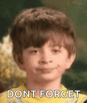 Young Boy Smiling Saying Don't Forget In Yellow Shirt GIF