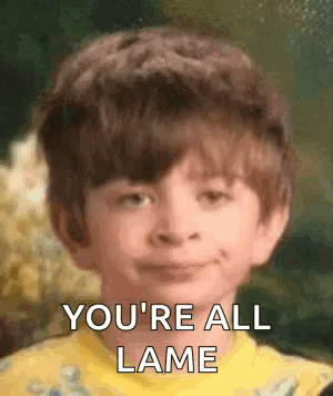 Young Boy Smiling Saying You're All Lame in Yellow Shirt