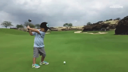 Young Boy Swings Golf Club Sponsored by Awesome