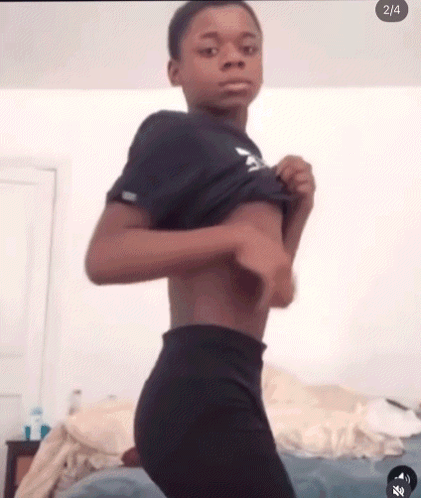 Young Boy Taking Off Clothes